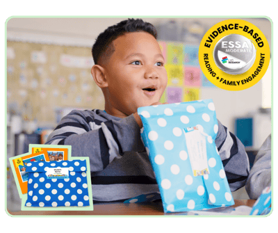student holding Take-Everywhere Literacy Packs
