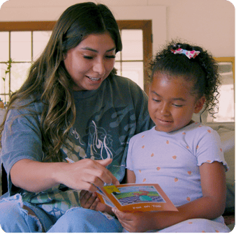 Child reading a decodable book